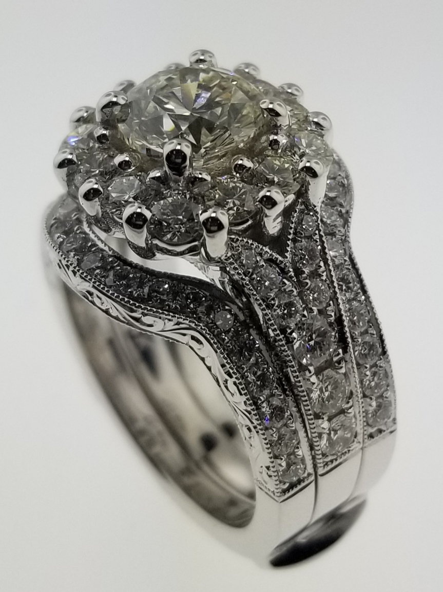Hand-engraved diamond cluster ring showing detailed shank work