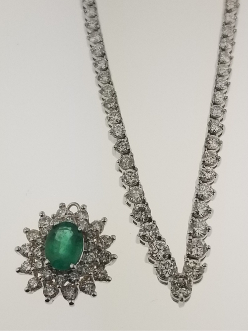 Emerald and diamond pendant on a diamond tennis necklace